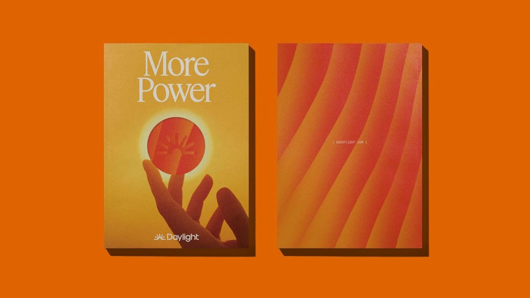 Two orange Daylight books, one titled More Power